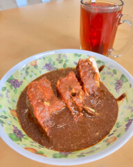 Spicy stuffed tofu drenched in peanut sauce.
