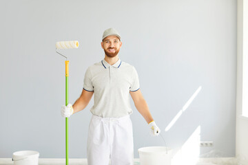 Professional happy smiling man service, successful painter, construction worker in uniform with...