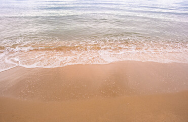 Nature of the beach and sea Summer with sunshine, sandy beaches, clear blue waters sparkling against the blue sky. On an island with good ecology and environment Background for summer vacation