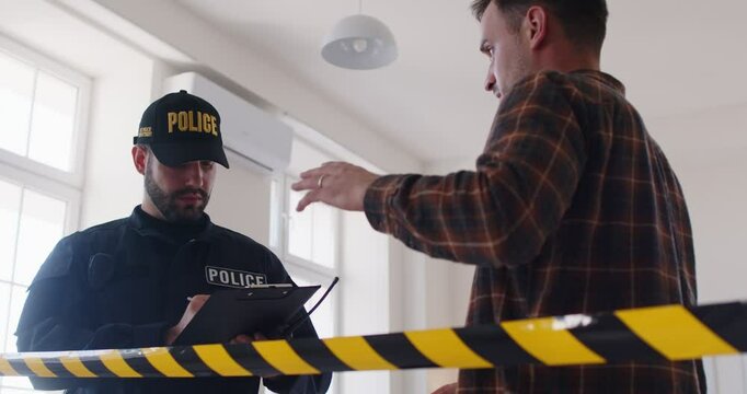 Concentrated detective or police officer is taking testimony from a witness at a crime scene, collecting evidence and investigating an accident or robbery, ensuring security and justice.