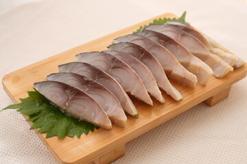 soused mackerel (shimesaba) on wooden board