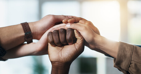 Hands, people and fist of group together for support, help and solidarity in office. Men, women or...