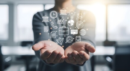 Person holding digital icons representing various business and financial concepts, symbolizing innovation and connectivity.