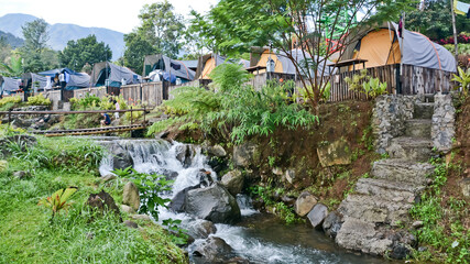 tropical riverside camping view, puncak mas, west java, indonesia
