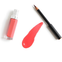 A bottle of lip gloss and a lip brush are displayed on a white background
