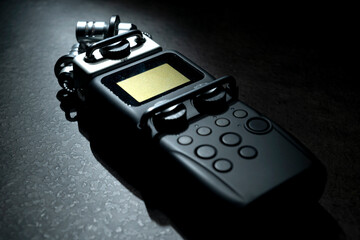 Handy recorder device on a black background