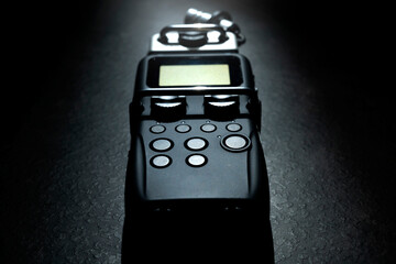 Handy recorder device on a black background
