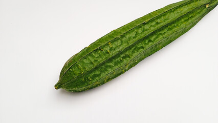 Raw Chinese Okra (Luffa)  or Sin Qua or Ridge Gourd Vegetable or Gambas or Oyong on white background. Authentic Asian vegetable ingredient