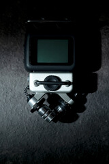 Handy recorder device on a black background. Top view