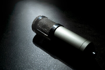 Studio microphone for podcasting or streaming with a black background