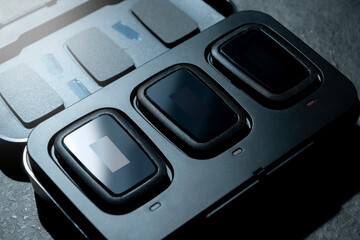 Clip on wireless microphone for interview or podcast equipment in the box on a black background