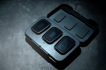 Clip on wireless microphone for interview or podcast equipment in the box on a black background