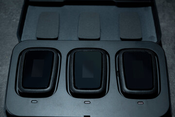 Clip on wireless microphone for interview or podcast equipment in the box on a black background