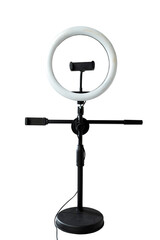 Round LED ring light with a phone holder isolated over a white background. Vlogging or live streaming equipment