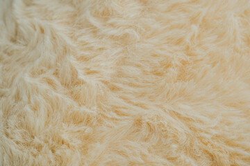 Creamy beige fur texture for pet product ads or winter fashion backgrounds
