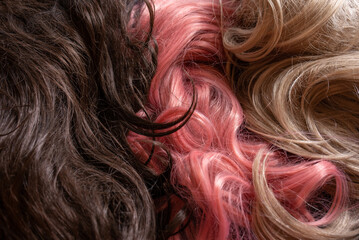 three different hair colors pink, blonde and brown