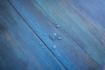 Water Drops on Blue Wooden Surface Close Up Abstract Texture Background