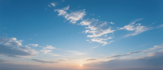 A highly realistic view of a deep blue sky during late afternoon, featuring soft, scattered clouds drifting across the frame.