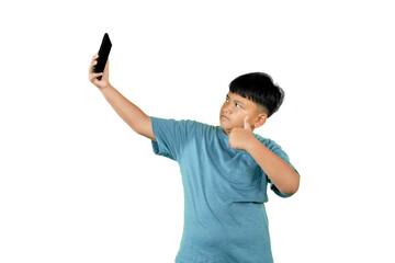 Asian Boy Taking Selfie with Smartphone and Showing Thumbs Up Gesture Isolated on White Background