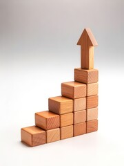 Wooden blocks and arrow representing business growth and upward trend concept