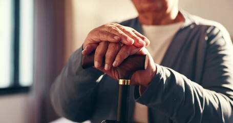 Hands, walking stick and senior man in home for healing, balance or arthritis recovery. Rehabilitation, wood cane and elderly male person with a disability for mobility aid, help or assistance. - Powered by Adobe