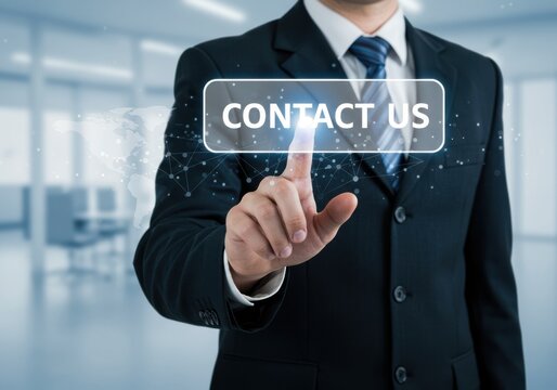 Businessman s finger touches interactive digital screen displaying contact us button with global network overlay - Powered by Adobe