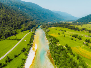 Rafting and kayaking place on the river. Kayakers in colorful life jacket paddling in Soca river, tolnim, Triglav National Park, Slovenia