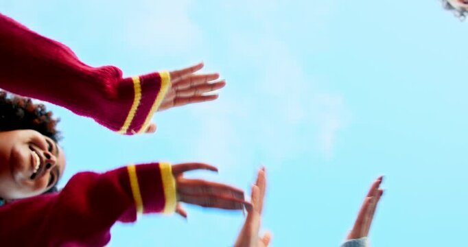 Applause, hands and huddle with friends on blue sky together for solidarity or support from below. Motivation, stack and team building with group of people clapping outdoor in nature for success