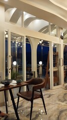 Modern Cafe Interior with Night View and Cozy Ambiance