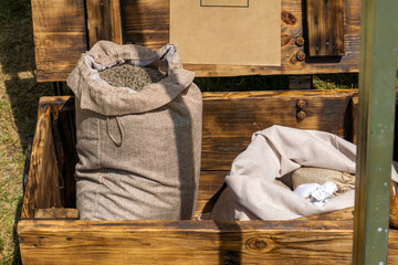 Linen sack filled with dried lavender on a rustic wooden stall