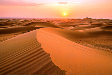 Serene sunset over abstract beige sand dunes
