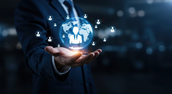 Businessman holding a glowing digital globe with connected user icons representing global network and human resources
