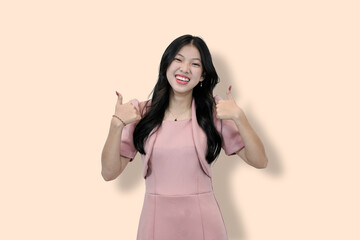 Enthusiastic Young Asian Woman Giving Thumbs Up