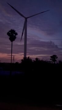 Wind Turbines Rotating Alongside Highway During Moving Drive.