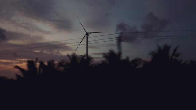 Spinning Wind Turbine Blades Captured From Ground View.