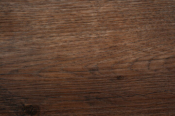 Dark brown wood texture background with straight grain lines and natural finish