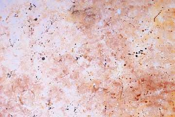 Textured abstract background with earthy tones and splattered designs