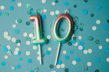 Celebrating a special occasion with colorful number candles and confetti