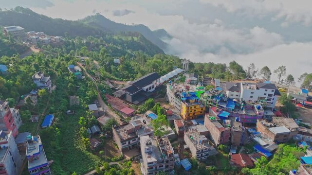 This aerial video shows Manakamana Hill in Gorkha, Nepal, a spiritual and scenic site known for its Hindu temple, panoramic mountain views, and the cable car that connects pilgrims to the hilltop.