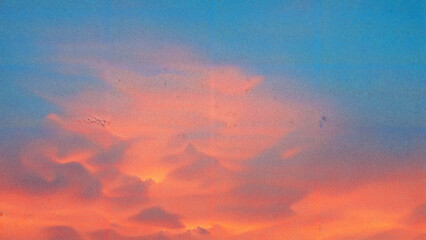 Soft pink clouds illuminated by sunset glow