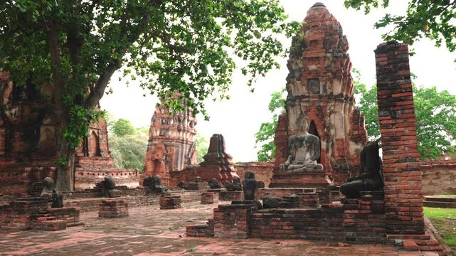 Main Prang and Buddha Statue of Wat Mahathat Temple Ruins, Ayutthaya. Ancient Thai Architecture
