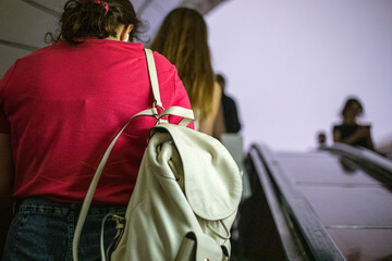 people in the subway going up and down the escalators during an air raid siren