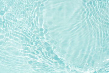 Blue water with ripples on the surface. Defocus blurred transparent blue colored clear calm water...