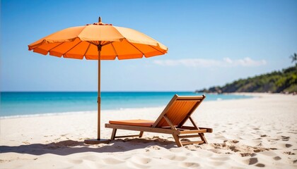 Idyllic beach scene with an orange parasol and a recliner on a sandy beach, ideal for summer getaway imagery and coastal living themes.