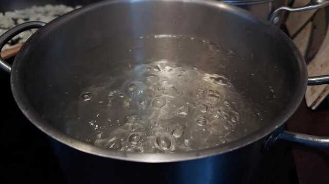 Bubbling boiling water in stainless steel cooking pot