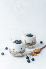 Yogurt granola parfaits topped with fresh blueberries