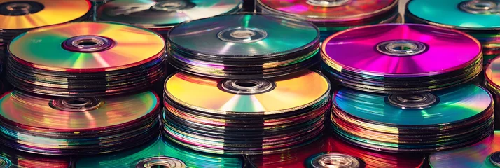 Fototapete Musikladen Isolated retro compact disc (CDs), digital video discs (DVD) or CD-ROM. Vintage 90s and 2000s computer technology, music or film media concept graphic or background  © Daniel