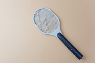 Electric bug zapper on beige background