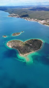Vertical Drone view of the beautiful Galesnjak, the Heart-Shaped Island in Croatia&rsquo;s Adriatic Sea, also known as Lover&rsquo;s Island or Otok za Zaljubljene.	
