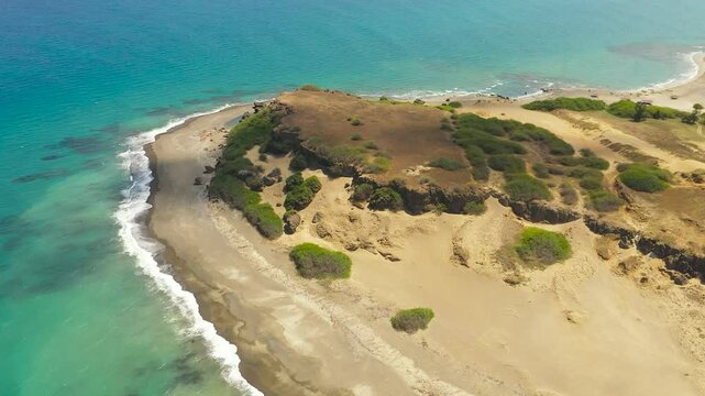 Seascape with tropical sandy beach and blue ocean. Philippines.